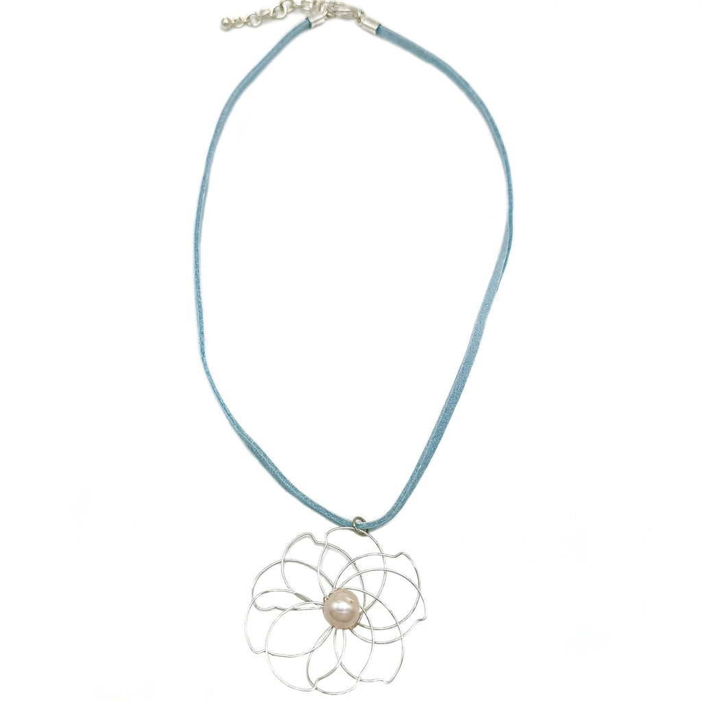 Petals silver flower and pearl pendant on a blue suede necklace